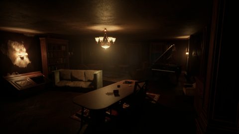 The dormitory common room from another angle, with a sofa and bookshelves
