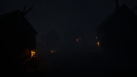 A foggy village at night with a few lit windows